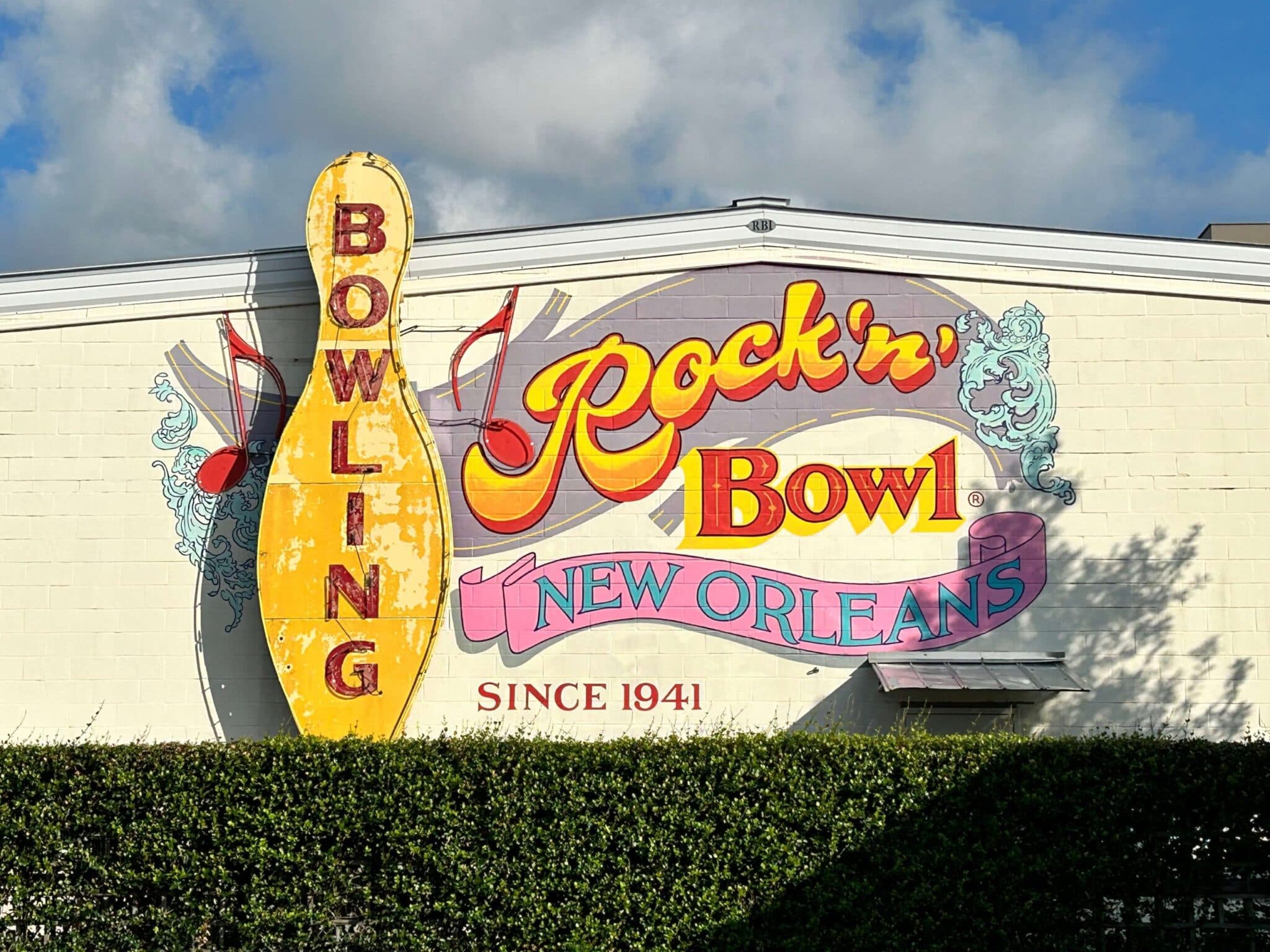 Sign for Rock'n Bowl in New Orleans, featuring a large bowling pin and musical notes. Sign for Rock'n Bowl in New Orleans, featuring a large bowling pin and musical notes.